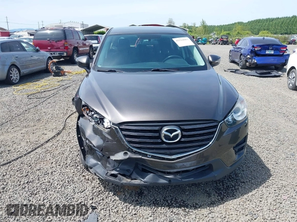 2016 Mazda CX-5 Sport with VIN JM3KE4BY8G0785812, listed as a IAAI auction lot 42324083 with 57,405 mi miles and . Bid and sale history available at DreamBid. Image 12.