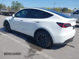 2021 Tesla Model Y Long Range with VIN 5YJYGDEEXMF280480, listed as a IAAI auction lot 41993633 with 69,579 mi miles. Bid and sale history available at carsss.com. Image 3.
