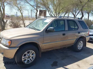 2002 Isuzu Rodeo S z VIN 4S2CK58W024305673, wystawiony jako IAAI lot #42205119 z przebiegiem Nie podano mil oraz . Historia ofert i sprzedaży dostępna na DreamBid. Obrazek 13.