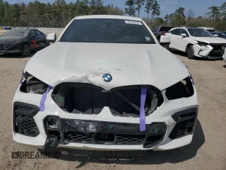 2022 BMW X6 xDrive40i z VIN 5UXCY6C0XN9K78927, wystawiony jako Copart lot #48348335 z przebiegiem 63 074 mil mil oraz Szkoda całkowita • Salvage title. Historia ofert i sprzedaży dostępna na DreamBid. Obrazek 5.