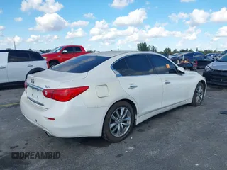 2014 Infiniti Q50 Sport with VIN JN1BV7AR7EM699663, listed as a IAAI auction lot 41532264 with 124,701 mi miles and . Bid and sale history available at DreamBid. Image 4.
