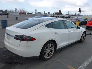 2014 Tesla Model S 60 with VIN 5YJSA1H14EFP34738, listed as a IAAI auction lot 42132117 with 120,898 mi miles and . Bid and sale history available at DreamBid. Image 4.