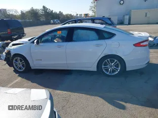 2015 Ford Fusion SE Hybrid with VIN 3FA6P0LU3FR249444, listed as a IAAI auction lot 41602659 with 145,024 mi miles. Bid and sale history available at carsss.com. Image 14.