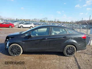 2013 Ford Fiesta S z VIN 3FADP4AJ2DM129703, wystawiony jako IAAI lot #41669041 z przebiegiem 138 831 mil mil oraz . Historia ofert i sprzedaży dostępna na DreamBid. Obrazek 14.
