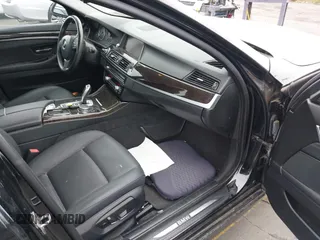 2015 BMW 5 Series 528i with VIN WBA5A5C56FD514814, listed as a IAAI auction lot 42052381 with 76,306 mi miles. Bid and sale history available at carsss.com. Image 5.