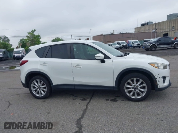 2015 Mazda CX-5 Grand Touring with VIN JM3KE4DY5F0530854, listed as a IAAI auction lot 42274582 with 144,732 mi miles and . Bid and sale history available at DreamBid. Image 13.