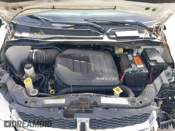 2012 Dodge Grand Caravan SXT with VIN 2C4RDGCGXCR358794, listed as a IAAI auction lot 42007316 with 212,518 mi miles and . Bid and sale history available at DreamBid. Image 10.