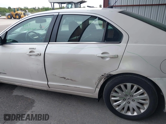 2010 Ford Fusion Hybrid with VIN 3FADP0L35AR182062, listed as a IAAI auction lot 42399945 with 101,565 mi miles and . Bid and sale history available at DreamBid. Image 12.