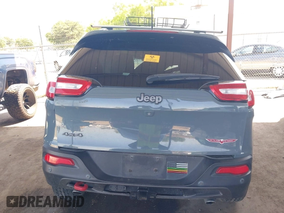 2014 Jeep Cherokee Trailhawk with VIN 1C4PJMBS5EW134900, listed as a IAAI auction lot 41997316 with 96,445 mi miles. Bid and sale history available at carsss.com. Image 16.
