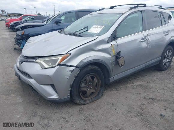 2016 Toyota RAV4 LE with VIN 2T3ZFREV2GW249128, listed as a IAAI auction lot 41696489 with 115,816 mi miles. Bid and sale history available at carsss.com. Image 2.