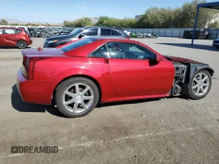 2004 Cadillac XLR z VIN 1G6YV34A345600127, wystawiony jako Copart lot #68859774 z przebiegiem 40 727 mil mil oraz Szkody całkowita. Historia ofert i sprzedaży dostępna na DreamBid. Obrazek 3.