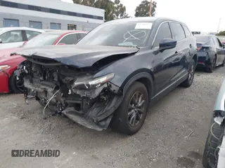 2021 Mazda CX-9 Touring with VIN JM3TCACY9M0526880, listed as a IAAI auction lot 42310923 with 25,991 mi miles and . Bid and sale history available at DreamBid. Image 2.