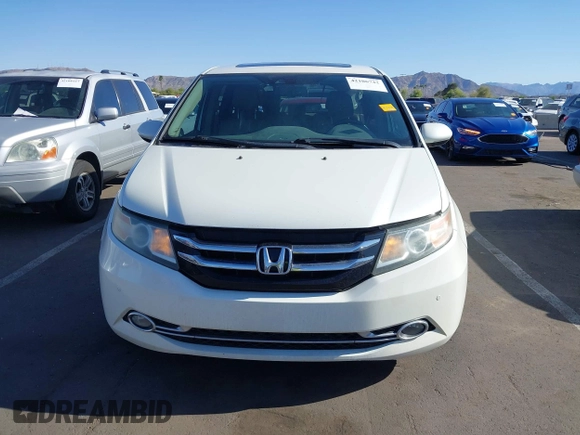 2014 Honda Odyssey Touring with VIN 5FNRL5H97EB037361, listed as a IAAI auction lot 42106742 with 198,279 mi miles and . Bid and sale history available at DreamBid. Image 6.