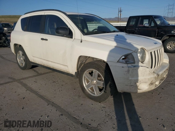 2007 Jeep Compass Sport with VIN 1J8FF47W07D199198, listed as a Copart auction lot 52092675 with 131,346 mi miles and Salvage Title. Bid and sale history available at carsss.com. Image 4.