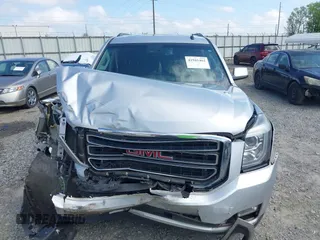 2015 GMC Yukon SLT z VIN 1GKS2BKC0FR100064, wystawiony jako IAAI lot #41941462 z przebiegiem 136 740 mil mil oraz . Historia ofert i sprzedaży dostępna na DreamBid. Obrazek 12.
