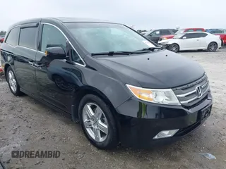2012 Honda Odyssey Touring with VIN 5FNRL5H96CB058828, listed as a IAAI auction lot 41731389 with 152,295 mi miles and . Bid and sale history available at DreamBid. Image 1.