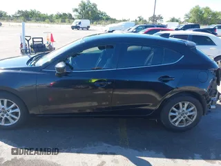 2014 Mazda 3 i Grand Touring z VIN JM1BM1M78E1159912, wystawiony jako IAAI lot #42079661 z przebiegiem 105 039 mil mil oraz . Historia ofert i sprzedaży dostępna na DreamBid. Obrazek 15.