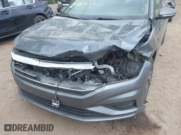 2021 Volkswagen Jetta SEL Premium z VIN 3VWG57BU8MM017203, wystawiony jako IAAI lot #42263741 z przebiegiem 26 556 mil mil oraz . Historia ofert i sprzedaży dostępna na DreamBid. Obrazek 6.