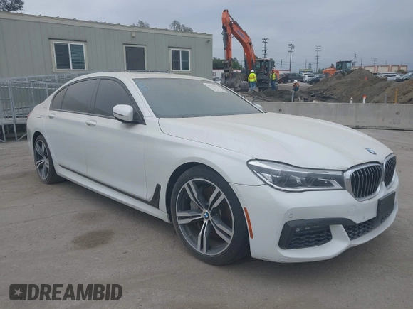 2019 BMW 7 Series 750i with VIN WBA7F0C5XKGM25771, listed as a IAAI auction lot 42167614 with 73,692 mi miles. Bid and sale history available at carsss.com. Image 1.