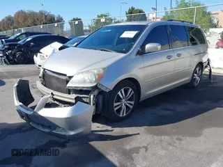 2005 Honda Odyssey TOURING with VIN 5FNRL38865B128519, listed as a IAAI auction lot 41830182 with 171,010 mi miles. Bid and sale history available at carsss.com. Image 20.