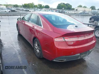 2015 Lincoln MKZ z VIN 3LN6L2GK8FR616005, wystawiony jako IAAI lot #42804770 z przebiegiem 241 352 mil mil oraz . Historia ofert i sprzedaży dostępna na DreamBid. Obrazek 3.