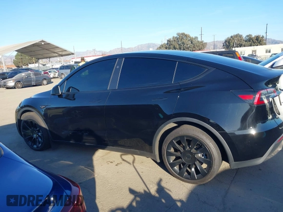 2024 Tesla Model Y Long Range with VIN 7SAYGDEEXRA216186, listed as a IAAI auction lot 41106653 with 25,331 mi miles and . Bid and sale history available at DreamBid. Image 14.