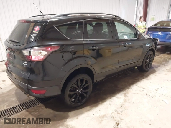 2017 Ford Escape SE with VIN 1FMCU9GD8HUF04133, listed as a IAAI auction lot 41390354 with 93,139 mi miles. Bid and sale history available at carsss.com. Image 4.