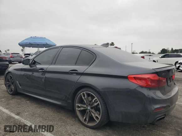 2019 BMW 5 Series M550i xDrive with VIN WBAJB9C59KB287501, listed as a Copart auction lot 59732425 with 74,345 mi miles and Salvage title. Bid and sale history available at DreamBid. Image 2.