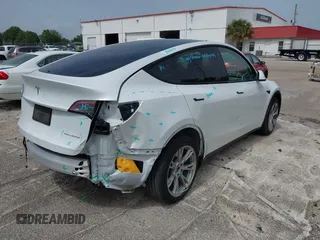 2023 Tesla Model Y Long Range z VIN 7SAYGDEE0PA065534, wystawiony jako IAAI lot #42445868 z przebiegiem 22 638 mil mil oraz . Historia ofert i sprzedaży dostępna na DreamBid. Obrazek 19.