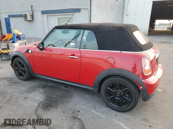 2015 MINI Convertible with VIN WMWZN3C59FT862963, listed as a Copart auction lot 86016514 with 96,493 mi miles and Salvage title. Bid and sale history available at DreamBid. Image 2.