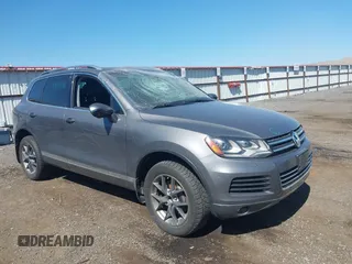 2014 Volkswagen Touareg X with VIN WVGEP9BPXED005458, listed as a IAAI auction lot 42465528 with 192,652 mi miles and . Bid and sale history available at DreamBid. Image 1.