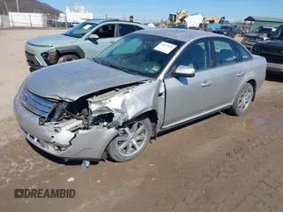2008 Ford Taurus SEL with VIN 1FAHP27W48G103208, listed as a IAAI auction lot 41675026 with 154,608 mi miles. Bid and sale history available at carsss.com. Image 2.