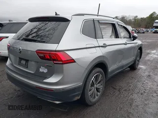 2021 Volkswagen Tiguan SE with VIN 3VV2B7AX8MM100651, listed as a IAAI auction lot 41803931 with 69,405 mi miles and . Bid and sale history available at DreamBid. Image 4.