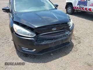 2016 Ford Focus Titanium z VIN 1FADP3J20GL310467, wystawiony jako IAAI lot #42478332 z przebiegiem 214 479 mil mil oraz . Historia ofert i sprzedaży dostępna na DreamBid. Obrazek 6.