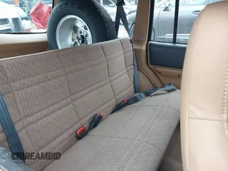 1997 Jeep Cherokee Sport with VIN 1J4FJ68SXVL582060, listed as a IAAI auction lot 41333519 with 183,580 mi miles. Bid and sale history available at carsss.com. Image 8.
