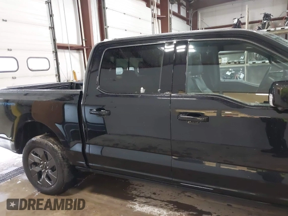 2023 Ford F-150 Lightning Pro with VIN 1FTVW1EV5PWG59228, listed as a IAAI auction lot 40838790 with Not Provided miles and . Bid and sale history available at DreamBid. Image 14.