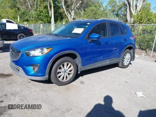 2014 Mazda CX-5 Touring with VIN JM3KE2CYXE0310873, listed as a IAAI auction lot 41309633 with 175,325 mi miles and . Bid and sale history available at DreamBid. Image 18.