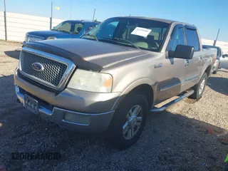 2004 Ford F-150 XLT with VIN 1FTPW14584KC35765, listed as a IAAI auction lot 41249586 with 322,715 mi miles. Bid and sale history available at carsss.com. Image 2.