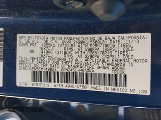 2014 Toyota Tacoma with VIN 3TMLU4EN5EM140028, listed as a IAAI auction lot 40965372 with 94,372 mi miles and . Bid and sale history available at DreamBid. Image 9.