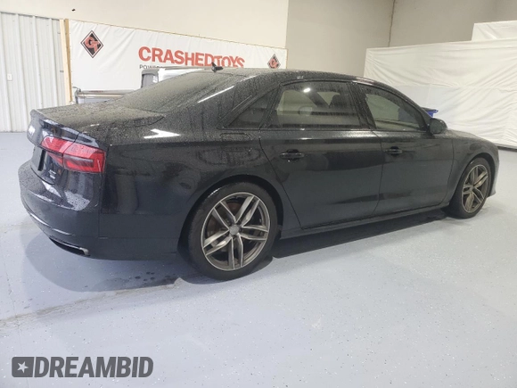 2017 Audi A8 Sport z VIN WAU43AFD4HN020515, wystawiony jako Copart lot #44953055 z przebiegiem 115 422 mil mil oraz Szkody całkowita. Historia ofert i sprzedaży dostępna na DreamBid. Obrazek 3.