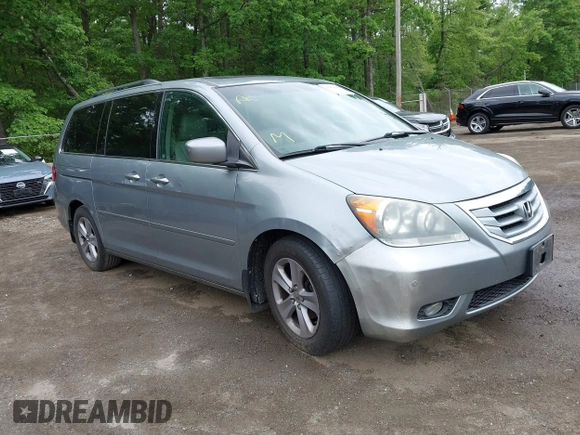 2008 Honda Odyssey Touring with VIN 5FNRL38908B066127, listed as a IAAI auction lot 42219444 with 188,868 mi miles and . Bid and sale history available at DreamBid. Image 1.