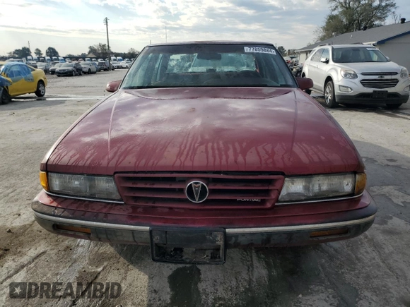 1990 Pontiac Bonneville z VIN 1G2HX54C7L1244134, wystawiony jako Copart lot #77859884 z przebiegiem 104 905 mil mil oraz Czysty tytuł • Clean title. Historia ofert i sprzedaży dostępna na DreamBid. Obrazek 5.