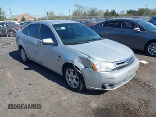 2008 Ford Focus SE with VIN 1FAHP35N48W243314, listed as a IAAI auction lot 42001321 with 210,639 mi miles. Bid and sale history available at carsss.com. Image 1.