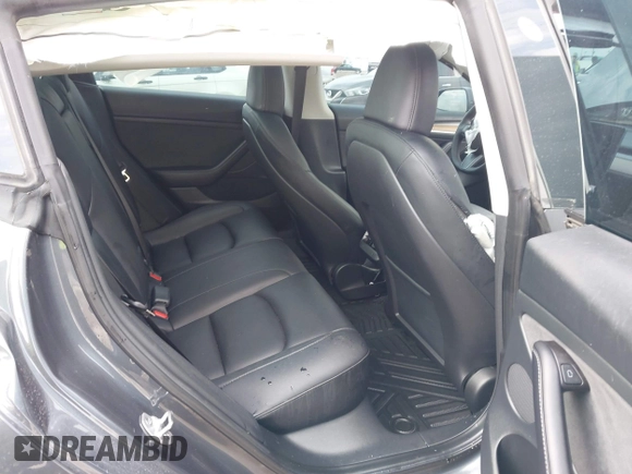 2023 Tesla Model 3 with VIN 5YJ3E1EA5PF676316, listed as a IAAI auction lot 42384765 with 33,715 mi miles and . Bid and sale history available at DreamBid. Image 8.