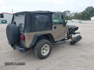 2003 Jeep Wrangler SE with VIN 1J4FA29113P304250, listed as a IAAI auction lot 40917099 with 191,589 mi miles. Bid and sale history available at carsss.com. Image 4.