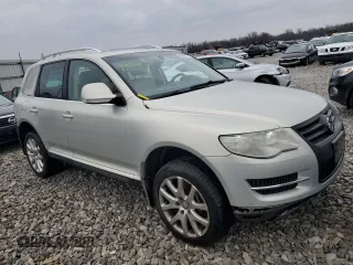 2010 Volkswagen Touareg VR6 with VIN WVGBF7A9XAD002471, listed as a Copart auction lot 83592274 with 202,497 mi miles and Salvage Title. Bid and sale history available at DreamBid. Image 4.