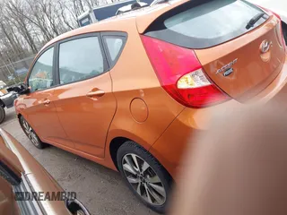 2015 Hyundai Accent Sport with VIN KMHCU5AE3FU205849, listed as a IAAI auction lot 41827093 with 112,980 mi miles. Bid and sale history available at carsss.com. Image 3.