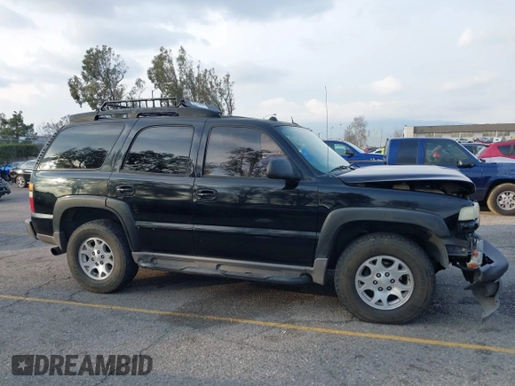 2004 Chevrolet Tahoe LS with VIN 1GNEK13T64R265302, listed as a IAAI auction lot 41445237 with 242,840 mi miles. Bid and sale history available at carsss.com. Image 13.