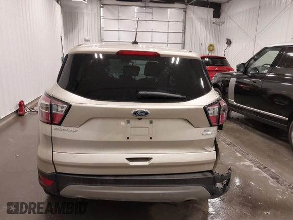 2017 Ford Escape SE z VIN 1FMCU0GD1HUE66952, wystawiony jako IAAI lot #41750959 z przebiegiem 86 442 mil mil oraz . Historia ofert i sprzedaży dostępna na DreamBid. Obrazek 16.