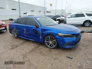 2023 Honda Civic Touring z VIN 2HGFE1F92PH317695, wystawiony jako IAAI lot #41556915 z przebiegiem 20 421 mil mil oraz . Historia ofert i sprzedaży dostępna na DreamBid. Obrazek 1.
